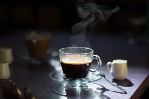 Cup of hot coffee on the table Stock Photos