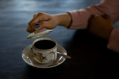A cup of hot coffee is on the table Stock Photos