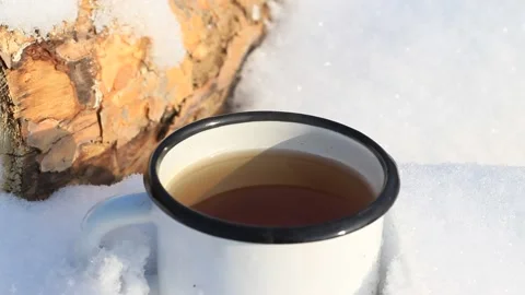Cup of Hot Coffee Tea Outdoors in Winter Snow Weather Picnic Mug of Hot Drink Stock Footage 167549889