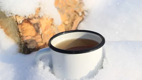Cup of Hot Coffee Tea Outdoors in Winter Snow Weather Stock Footage 167549891