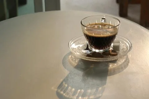 Cup of hot coffee on white table Stock Photos