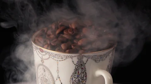 Cup with hot drink. coffee beans Stock Footage 101767225