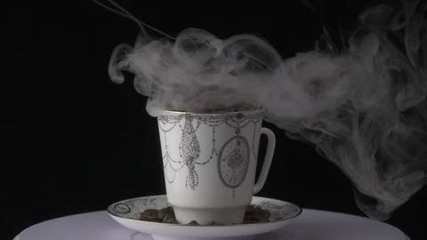 Cup with hot drink. coffee beans Stock Footage 101767748