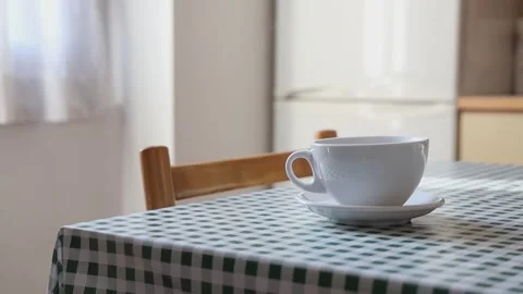 A cup of hot drink is on the dining table. Stock Footage 255245128