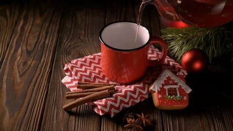 Cup of hot red berry tea on wooden background Stock Footage 122761618