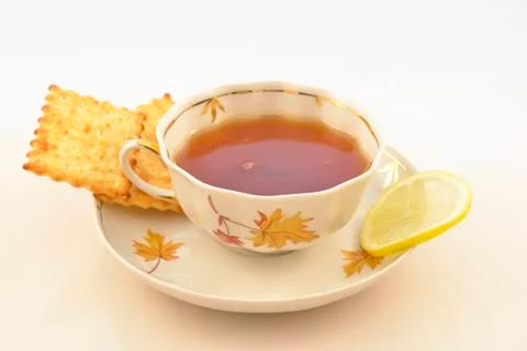 A cup of hot tea with lemon Stock Photos