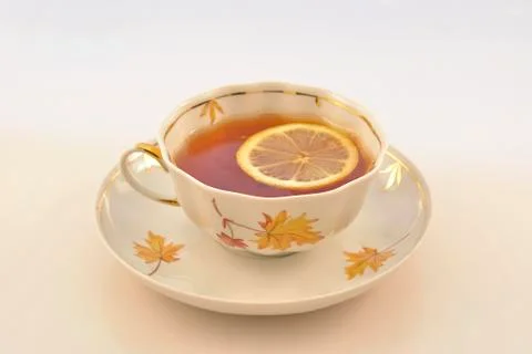 A cup of hot tea with lemon Stock Photos