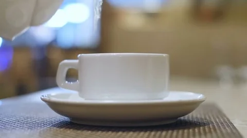 Cup hot tea is poured Stock Footage 72234577
