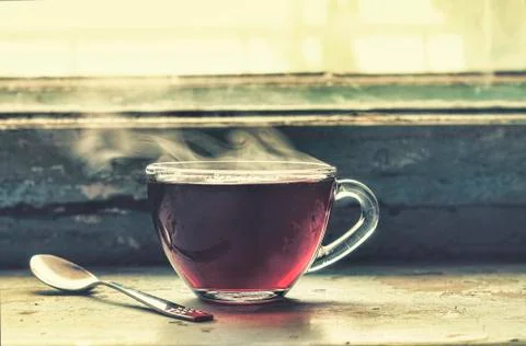 A cup of hot tea at the window. 스톡 사진