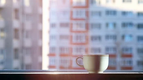 A cup of hot tea on the windowsill. Stock Footage 127054520