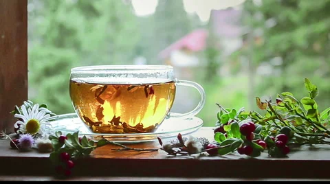 Cup of hot tea on a windowsill. Video. Stock Footage 62421278