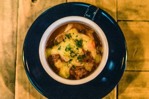 Cup of House Made Beef Chilli with cheese on top Stock Photos