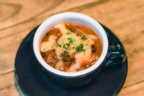 Cup of House Made Beef Chilli with cheese on top Stock Photos