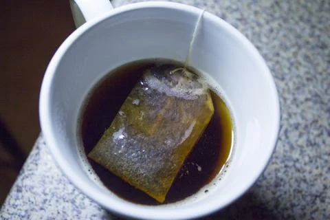 Cup with infusion Fotos de archivo