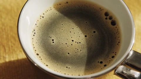 Cup of invigorating freshly brewed coffee on the table. Close-up of chicory Stock Footage 302908323