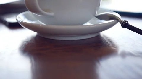 A cup of invigorating hot latte on the table. HD, 1920x1080, slow motion Stock Footage 96610567