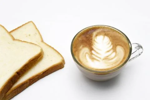 Cup of latte art coffee with bread Stock Photos