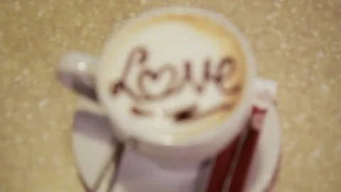 A cup of latte art coffee Stock Footage 76346283