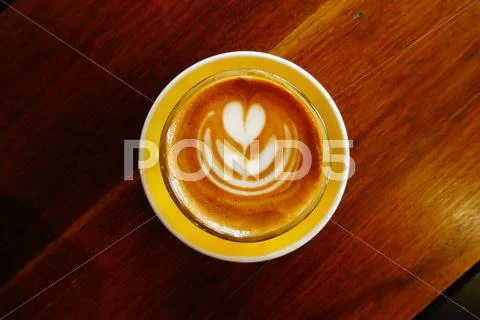 Cup of latte art coffee Stock Photos
