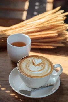 Cup of latte coffee and tea on wood table Stock Photos