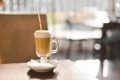 A cup of latte coffee is on the table Stock Photos
