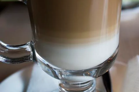 Cup of latte side view white foam Foto stock