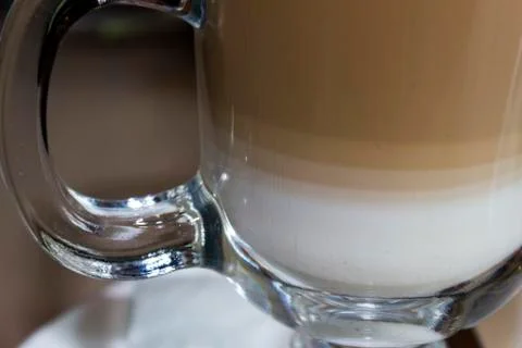 Cup of latte side view white foam Foto stock