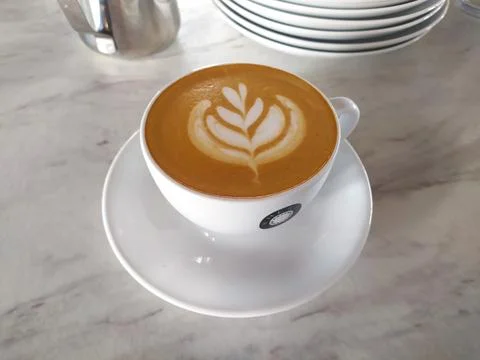 A cup of latte on  table Stock Photos