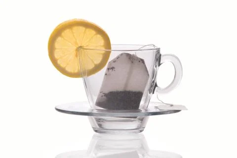 Cup with lemon slice and tea bag isolated on white background Stock Photos