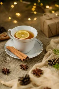 A cup of lemon tea, shot with selective focus, against a backdrop of Christma Foto stock