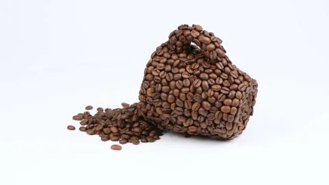 A cup made of coffee beans on white. Side view. Loop motion. Stock Footage 245080006