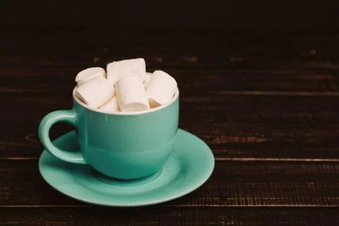Cup of marshmallow on the dark background Stock Photos