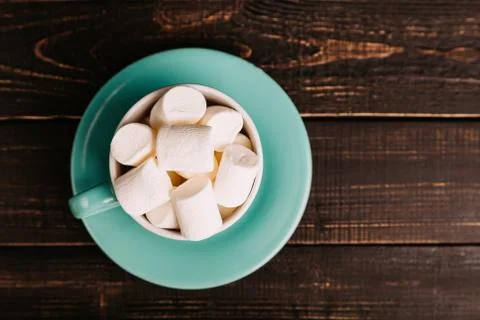 Cup of marshmallow on the dark background Stock Photos