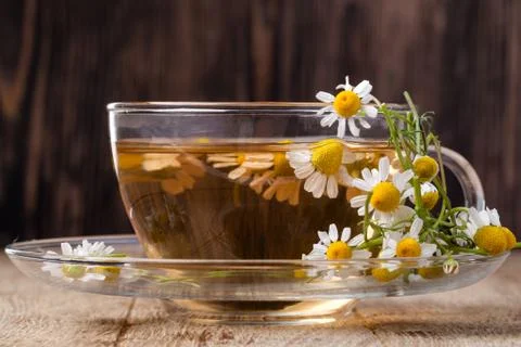 Cup of medicinal chamomile tea Stock Photos