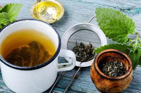 Cup of melissa tea Stock Photos