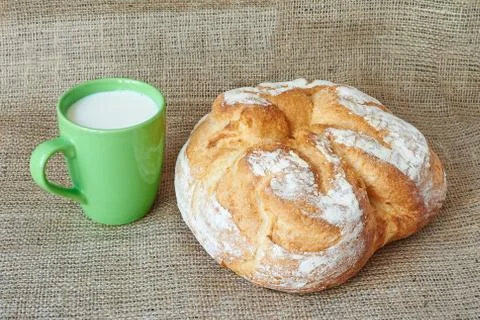 A cup of milk with bread Stock-Fotos