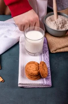 Cup of milk with cinnamon biscuits and flour Stock Photos