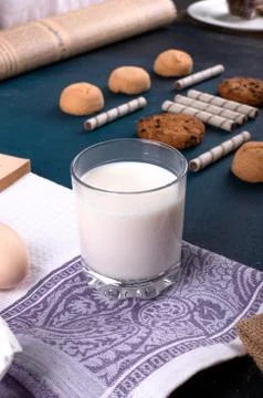 Cup of milk with cinnamon biscuits Stock Photos