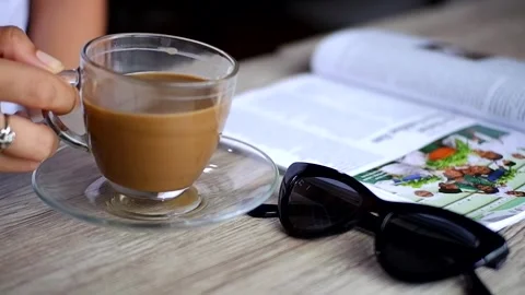 A cup of milk coffee on the table Stock Footage 241080722