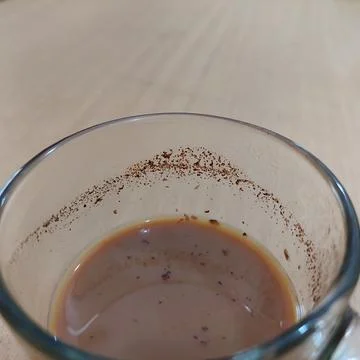 A cup of milk coffee on the table Stock Photos