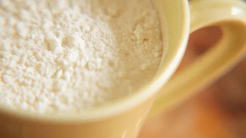 Cup of milk powder on table Stock Footage 76099909