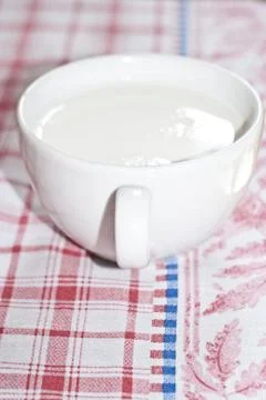 Cup of milk on the table Stock Photos