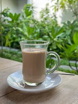 Cup of milk tea Stock Photos