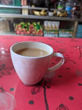A cup of milk tea on a red table Stock Photos