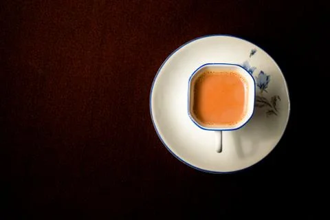 A cup of milk tea on the table Stock Photos