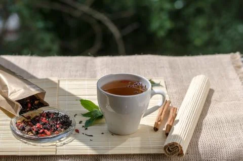 Cup of mint tea and a bunch of mint on the table Stock Photos
