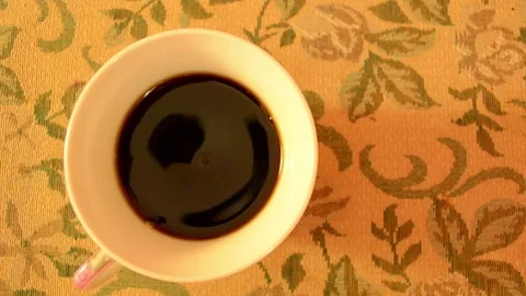 A Cup of morning coffee on the kitchen table. Stock Footage 140771276