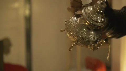 Cup of Moroccan tea spilled Marrakech traditional teapot man serving Marrakech Stock Footage 87459480