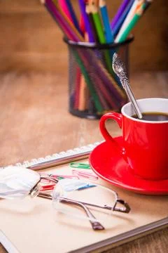 Cup with notebook Foto stock