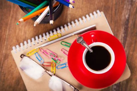 Cup with notebook Stock Photos